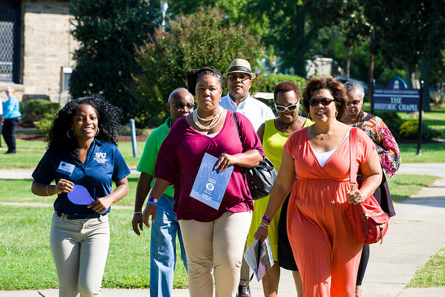 An SAU Student Tour Guide leading visitors across campus during the 2014 Legacy Tour